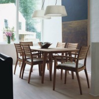 This set of Ballare chairs are shown with the Ballare table. The set creates a gorgeous solid teak dining set that works both indoors and outdoors.